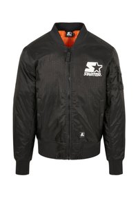 Giubbotto bomber nero con una texture liscia, polsini e colletto a coste. Presenta un logo bianco e una fodera interna arancione. Chiusura con zip.