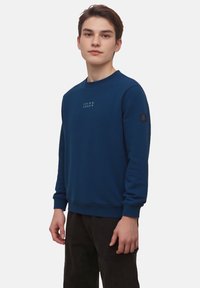 Navyblauw sweatshirt van katoen met een ronde hals, ribgebreide manchetten en een klein logo op de borst. Gevarieerd weefsel.