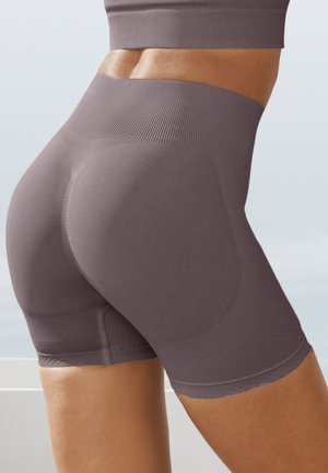 High-waisted, seamless shorts in a muted purple hue; textured accents and smooth fabric; mid-thigh length with a rounded back design.