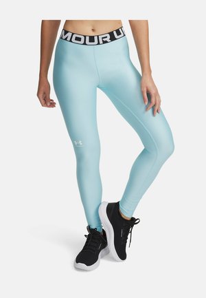 Lyseblå leggings med en sort talje med hvid tekst. Fremstillet af et glat materiale med en tætsiddende design og logo-detalje på benet.