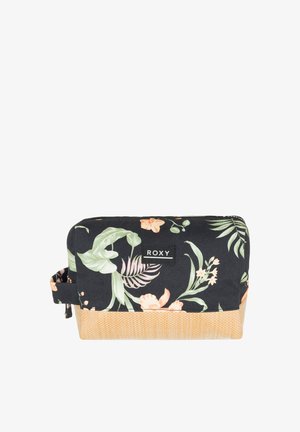 Bloemenstof make-up tas met een zwarte achtergrond, voorzien van groene bladeren en roze bloemen. Gevoerde gele onderkant en logo patch.