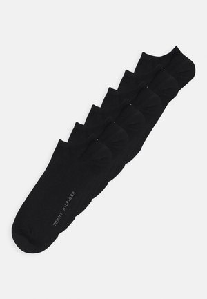 Black ankle socks in a pack of six. Made of soft material with a smooth texture. Features a small white logo printed on the side.