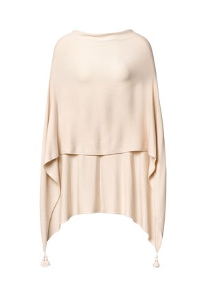 Light beige knitted poncho with a layered design, wide sleeves, and decorative tassels at the hem. Smooth texture and loose fit.
