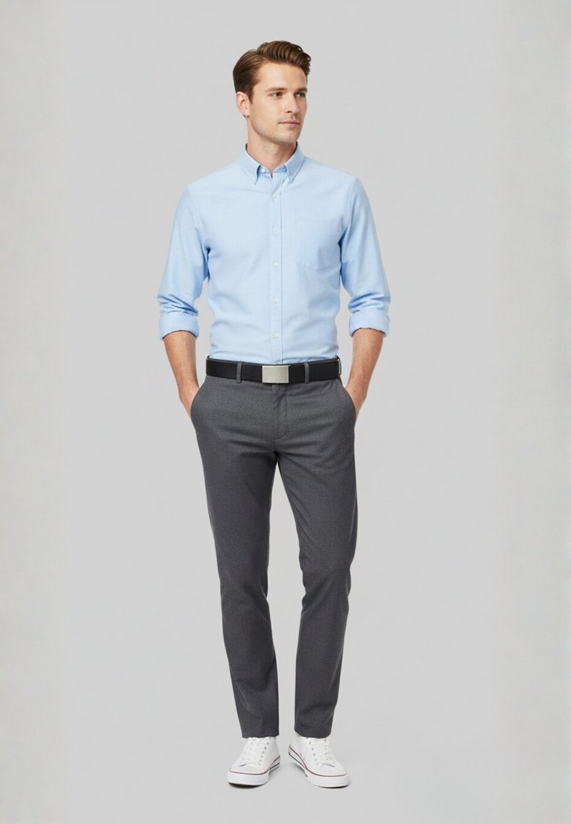 Light blue button-up shirt, gray trousers, black belt with silver buckle, and white sneakers. Simple, tailored design with long sleeves.