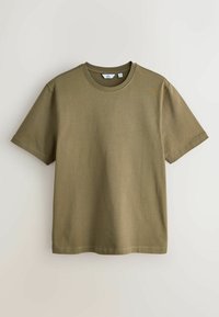 T-shirt uni vert olive à manches courtes et col rond, taille moyenne, présenté à plat sur un fond clair.