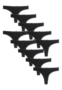 Perizoma nero con design senza cuciture, caratterizzato da piccoli fiocchi in vita e una texture morbida. Dieci pezzi esposti.