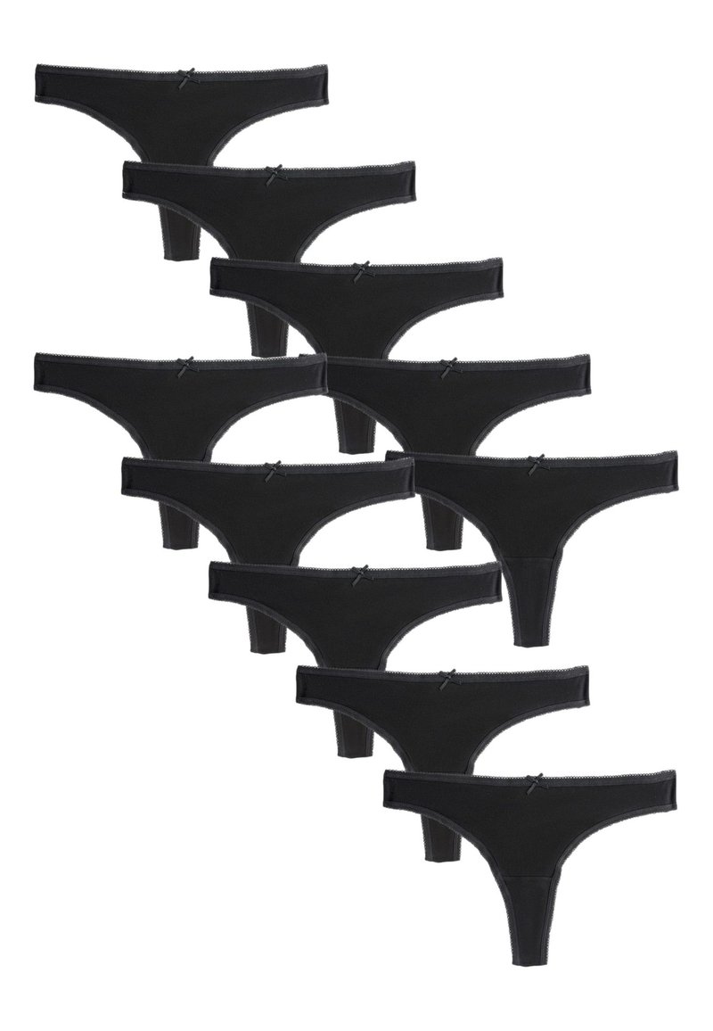 Perizoma nero con design senza cuciture, caratterizzato da piccoli fiocchi in vita e una texture morbida. Dieci pezzi esposti.