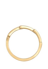 Goldfarbener Armreif mit einer glatten Oberfläche, der ein klappbares Design und abgerundete Kanten aufweist, was eine nahtlose kreisförmige Form schafft.