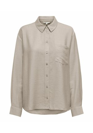 Beige langermet skjorte med knapper, med krage, enkelt brystlomme og lett avrundet hem. Myk, teksturert stoff. Fire knapper foran.