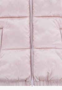 Light pink padded jacket with a front zipper, featuring smooth, shiny fabric, and gathered hem details. No visible pockets.