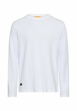 Langærmet hvid t-shirt lavet af blød bomuld, med rund hals, minimalistisk design og lille logo på brystet. Sort mærke ved kanten.