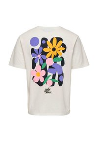 T-shirt de couleur crème arborant un imprimé floral abstrait vibrant aux teintes de violet, rose, jaune et vert. Comprend un petit logo en bas.