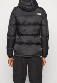 The North Face Daunenjacke - black