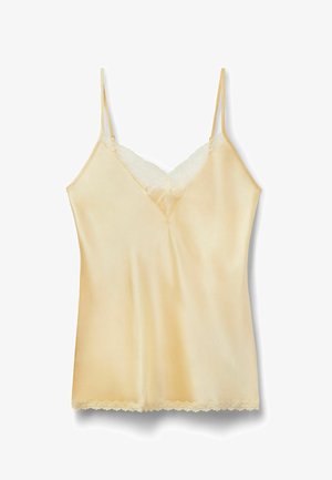 Camisole en satin crème avec fines bretelles ajustables, bordure en dentelle le long du décolleté en V et de l'ourlet.