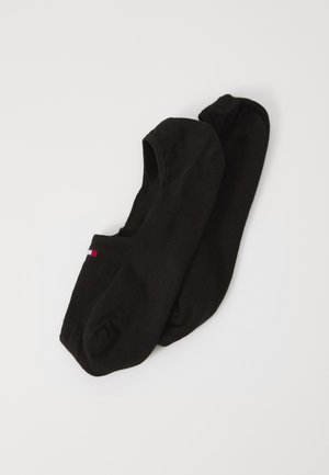 Svart bomullssockor utan visning med sömlös design, med ribbat mönster och minimal branding i röd och vit på sidan.
