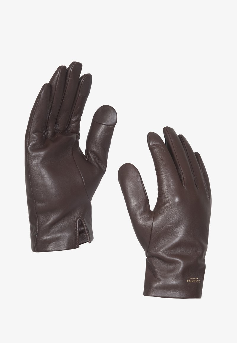 Gants en cuir marron avec une texture lisse, de forme ajustée et un design à poignet ouvert. Présente un logo discret au niveau du poignet.