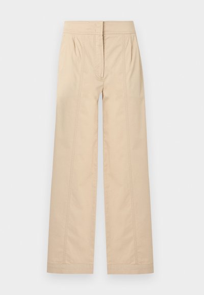 Μπεζ παντελόνια ψηλόμεσα με φαρδιά μπατζάκια, λεπτομέρειες με ραφή μπροστά και κρυφό φερμουάρ μπροστά.