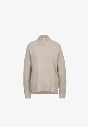 Beige geripptes Rollkragensweatshirt mit überschnittenen Schultern, ausgestattet mit einem goldenen Logoakzent am Saum und einem lässigen, oversized Schnitt.