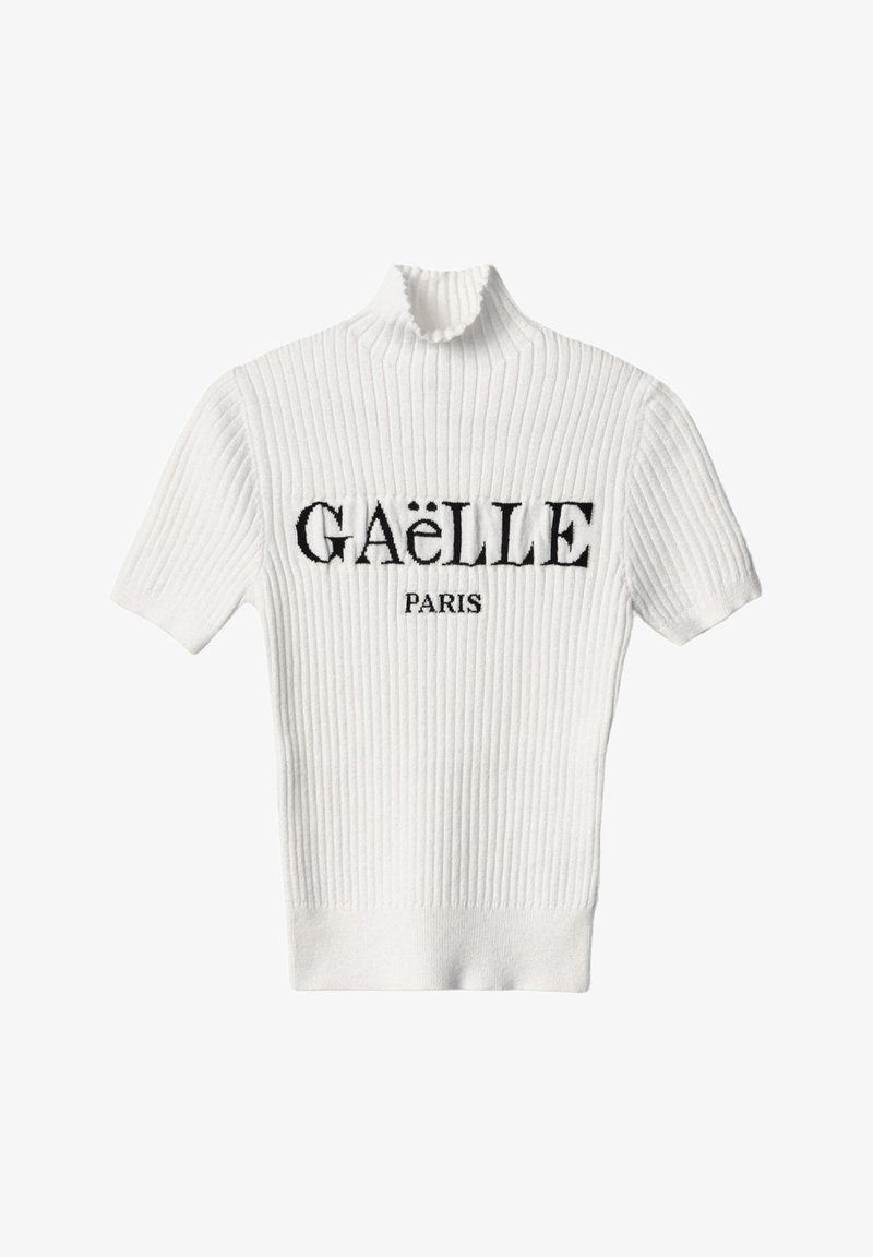 Maglione bianco a costine con collo alto e maniche corte. Presenta la scritta nera ricamata "GAËLLE PARIS" sul petto.