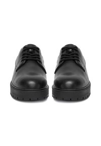 Black leather lace-up shoes with thick treaded soles, shown from front on a white background.