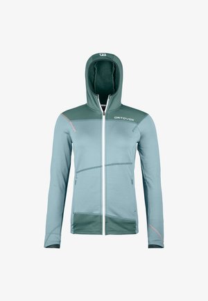 Light blue and green zip-up hooded jacket with a high collar, soft texture, contrasting seams, and logo on the upper left side.