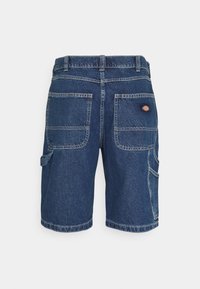 Denim shorts in dark blue with a straight cut, featuring multiple pockets, reinforced stitching, and a small logo patch on the back.