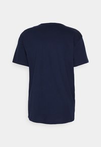 Navy blue cotton t-shirt with short sleeves and a crew neckline. Smooth texture, simple design, and no visible logos or graphics.