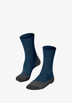 Marineblaue Socken mit gerippten oberen Teilen und dunkelgrauen verstärkten Fersen und Zehen, mit einem kleinen roten Logo an der Seite zur Identifizierung.