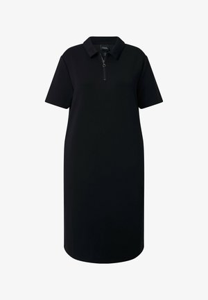 Musta polomekko polven pituinen, lyhyillä hihoilla, kauluksella ja eteen tulevalla vetoketjulla.