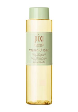 Flacon de tonique Pixi Vitamin-C, tonique éclaircissant à la vitamine C et à l'acide férulique, 250 ml, bouchon et étiquette vert clair sur liquide jaune clair.