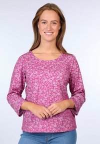 Pink floral-patterned top with three-quarter sleeves and a round neckline. The fabric appears lightweight and smooth with a subtle texture.