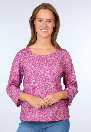 Pink floral-patterned top with three-quarter sleeves and a round neckline. The fabric appears lightweight and smooth with a subtle texture.