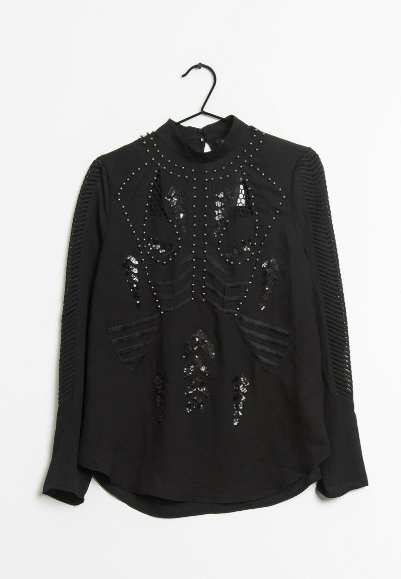Top nero a maniche lunghe con dettagli intricate in paillettes e perline, accenti a strisce testurizzate sulle maniche e un collo alto.