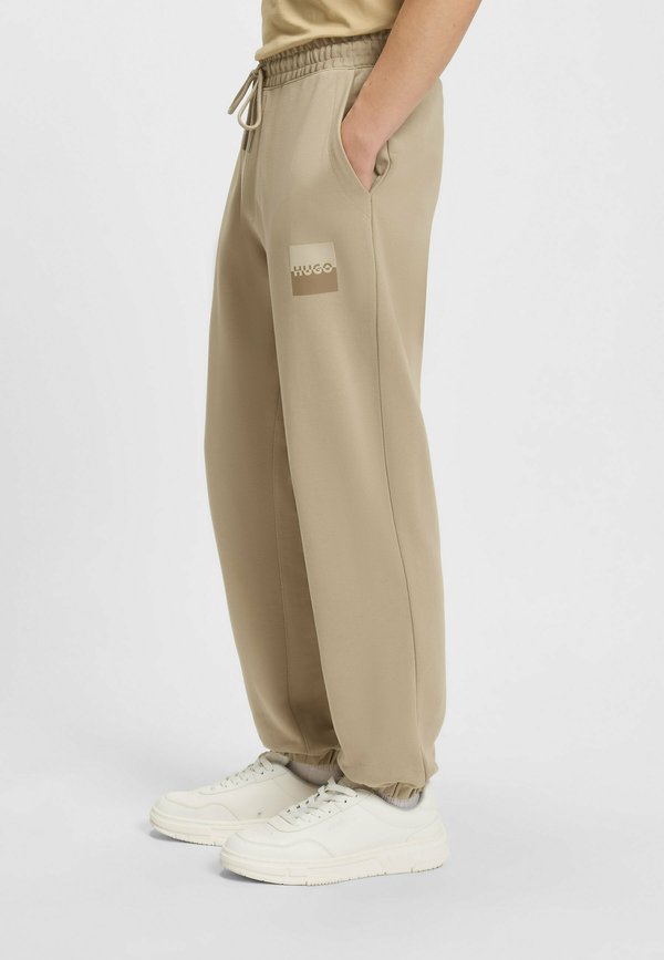 DUSPLITAN - Tracksuit bottoms - beige nine2