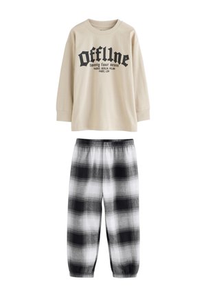 Maglietta beige a maniche lunghe con testo grafico nero e pantaloni del pigiama a quadri neri nelle tonalità di grigio e bianco, con vita elasticizzata.