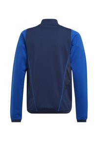 Navyblauwe jas met blauwe accenten, voorzien van een hoge kraag en meshpanelen aan de zijkanten. Gemaakt van een zachte, rekbare stof.