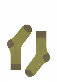 Zielone skarpetki w paski z ciemnozielonymi akcentami w okolicy palców i mankietów. Wykonane z miękkiego materiału, z wzmocnionymi obszarami palców i pięt.