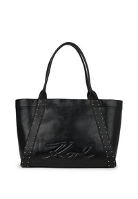 Czarna skórzana torba tote z podwójnymi uchwytami, złote �ćwieki na paskach oraz wytłoczone podpis "Karl" na przedniej części.