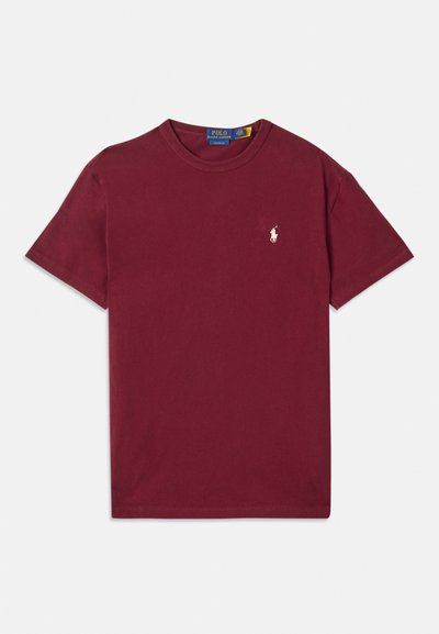 Burgundska bombažna majica s kratkimi rokavi, okroglega izreza, z izvezenim belim logotipom na levem prsnem delu. Gladka tekstura in klasičen kroj.