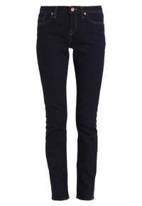 Mørkeblå denimjeans med smal passform, fem lommer, oransje sømmer og knappelukking foran.
