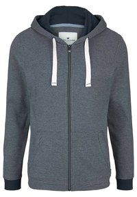 Hoodie grigia con zip, corde bianche, fodera blu navy e tasche frontali. Presenta polsini a coste e una texture a righe orizzontali.