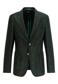 Mörkgrön kavaj i texturerad tyg, med slagkrage, två knappar och två framfickor. Inuti foder av tealtyg.