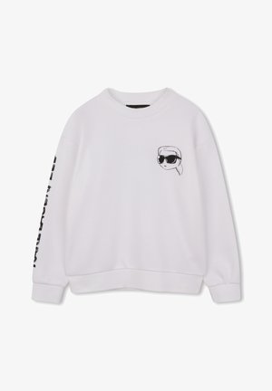 Bela majica s kapuco z grafiko obraza s sončnimi očali v črni barvi na prsih in črnim napisom na rokavu. Mehka tkanina, sproščen kroj.