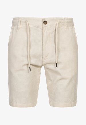 Beige shorts laget av teksturert materiale, med snøring og knappelukking. Har sidelommer og er knelang.