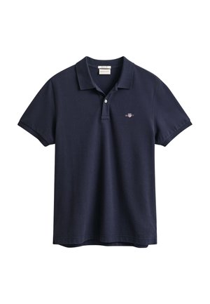 Donkerblauw poloshirt van katoen, met een knoopsluiting met twee knopen, korte mouwen en een klein geborduurd logo op de linkerborst.
