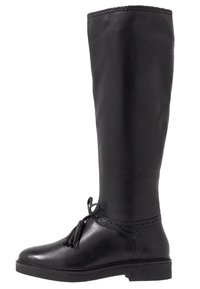 Bottes montantes en cuir noir avec une texture lisse, un détail décoratif de glands à l'avant et une semelle en caoutchouc robuste.