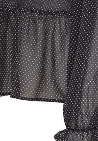 Blusa nera in tessuto trasparente con pois bianchi, corpino arricciato, maniche a ruffles e orlo, caratterizzata da un design leggero e testurizzato.