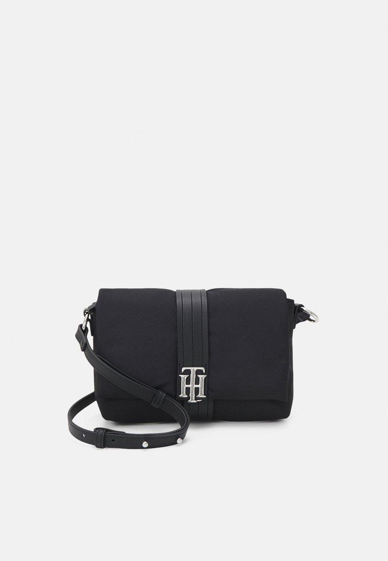 Black fabric handbag with a rectangular shape, silver hardware, two black leather straps, and an embossed logo on the front.