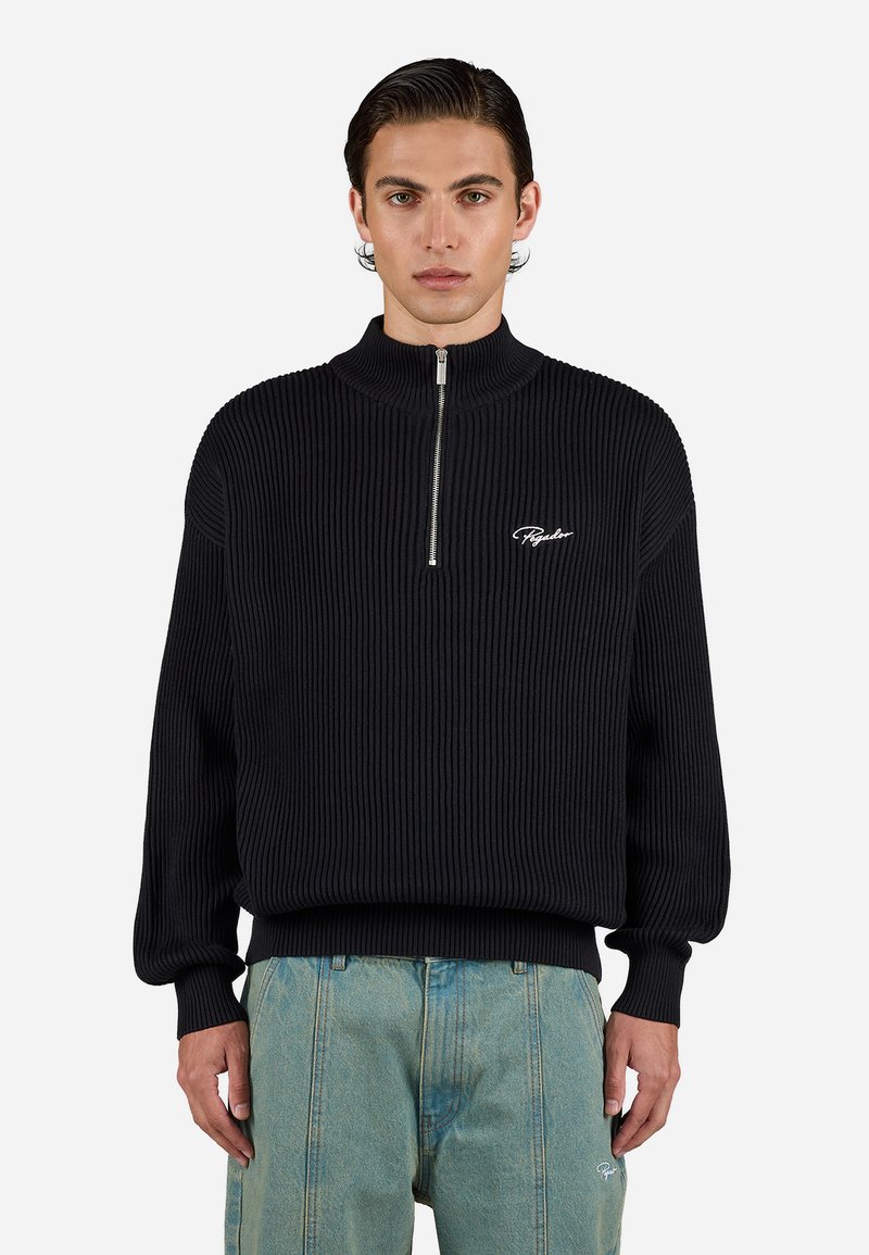 Black ribbed pullover sweatshirt with a high collar, zip front, and white embroidered logo. Features loose-fitting sleeves and a relaxed silhouette.