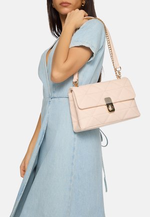 Pale pink quilted handbag with a gold chain strap and a clasp closure. The bag features a rectangular shape and smooth texture.